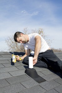 Man on Roof fixing Piping Vent